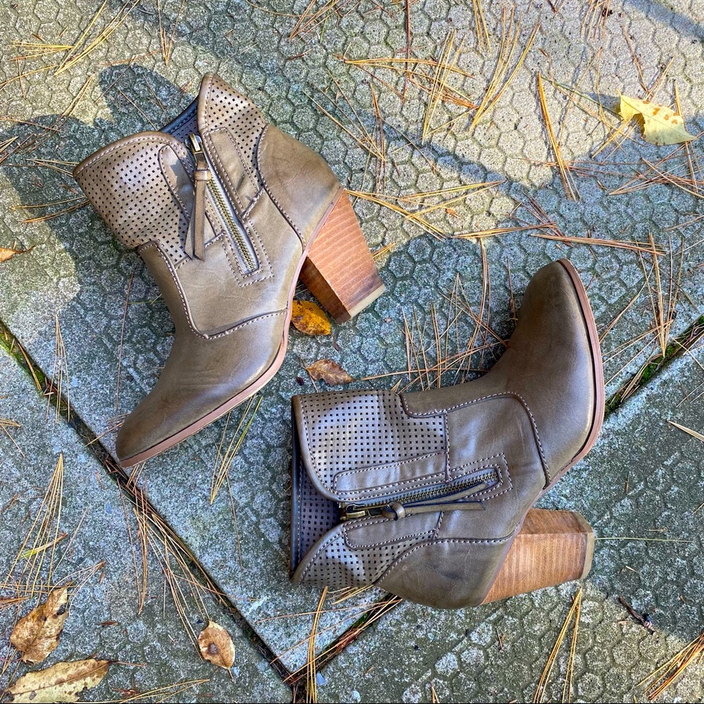 Report stacked heel leather ankle booties.